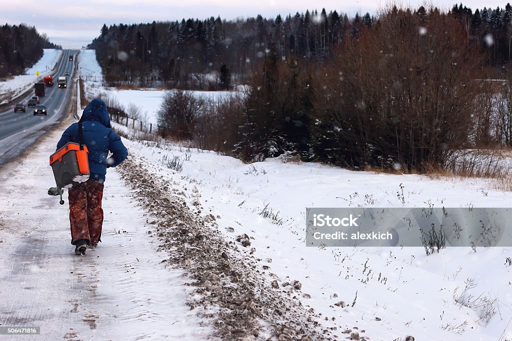 Winter fisherman walk fishing Rear View Stock Photo