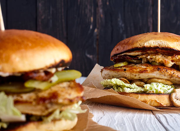 istock Burger with chicken, cheese sauce and mushrooms 506472246