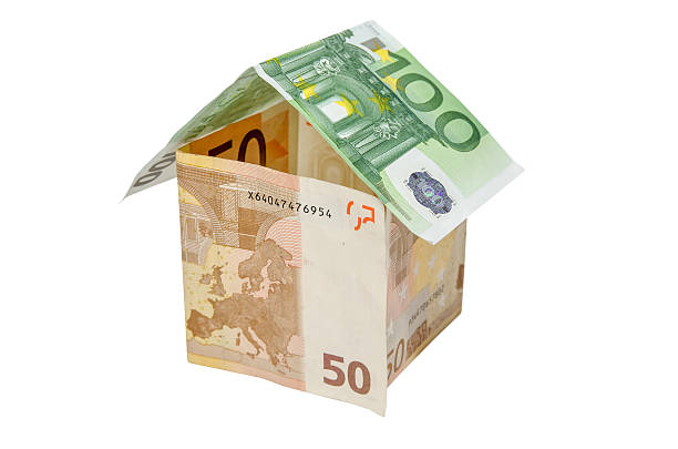 istock house made from euro bills isolated on white background 506472630