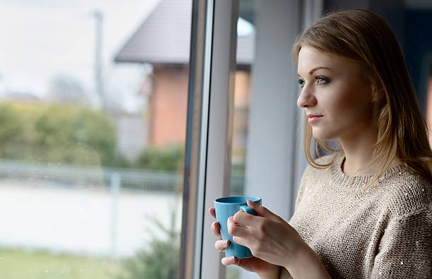 istock Woman drinking coffee from a cup 506472670