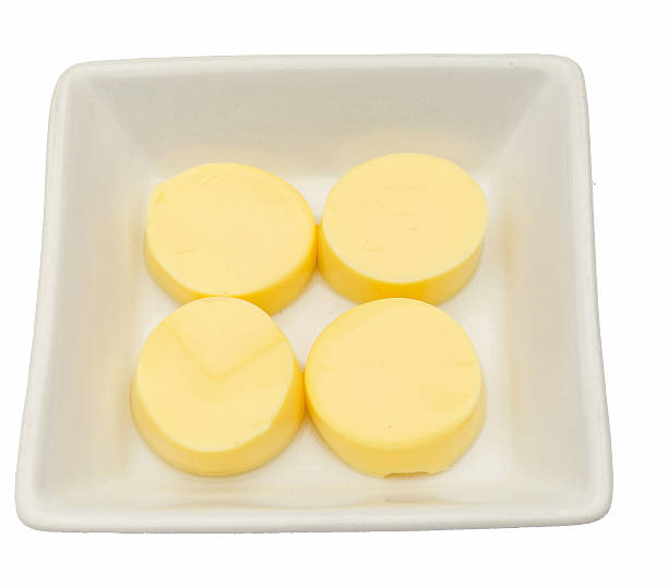 istock Tofu in white plate on white background 506472683