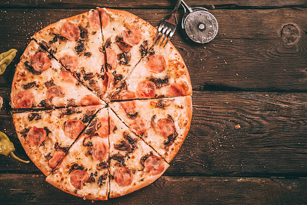 istock Homemade Pizza Slices with ham and mushrooms 506472818