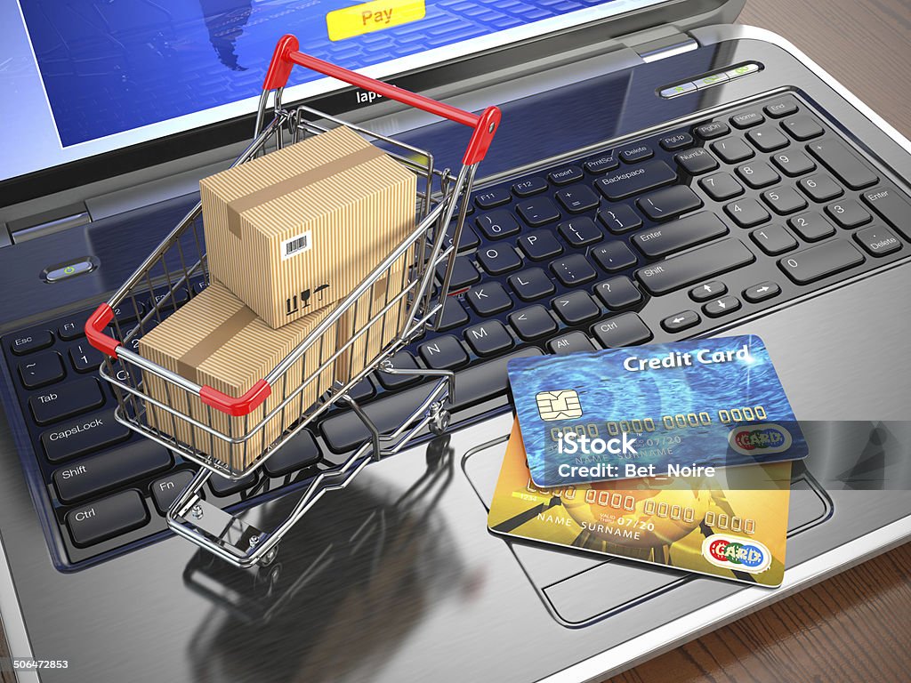 E-commerce. Shopping cart and credit cards on laptop. E-commerce. Shopping cart and credit cards on laptop. 3d E-commerce Stock Photo