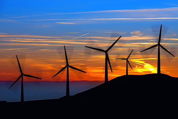 Free Stock Photo of Group of Windmills on Hill at Sunset | Download ...