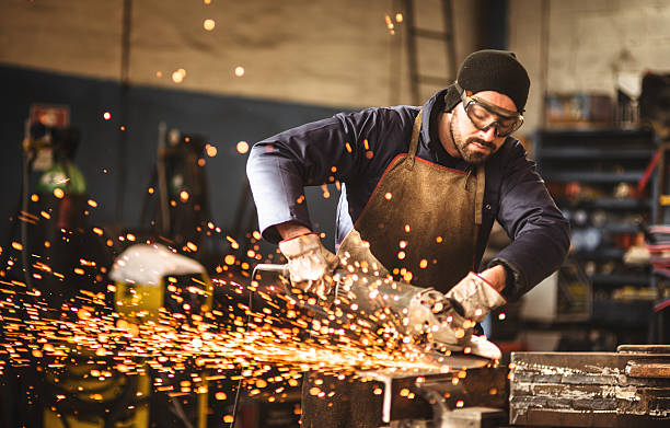 manual worker on a workshop manual worker on a workshop sparks photos stock pictures, royalty-free photos & images