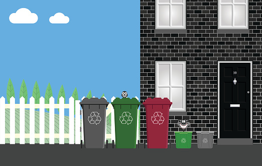 Recycling bins outside residential property ready for collection