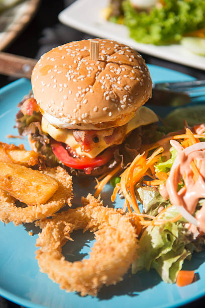 istock Pork burgers with fried onion and salad 506474318