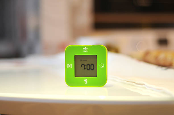 istock Green cube alarm clocks on the table 506474448
