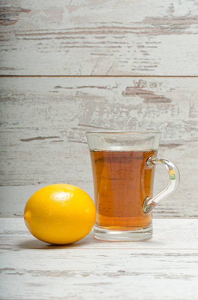 istock Cup of tea on wooden rustic background 506474880