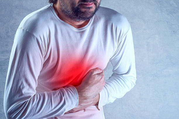 istock Man suffering from severe abdominal pain, hands on stomach 506475186