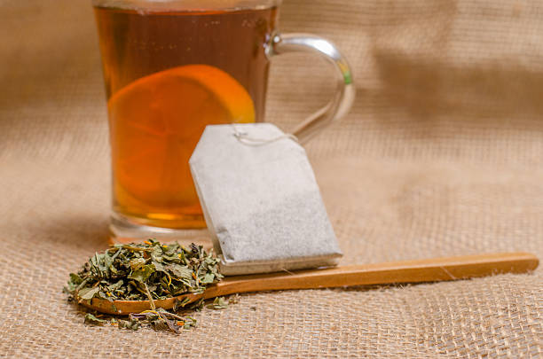 istock Cup of tea on wooden rustic background 506475958