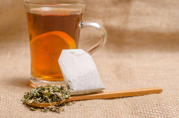 istock Cup of tea on wooden rustic background 506475996
