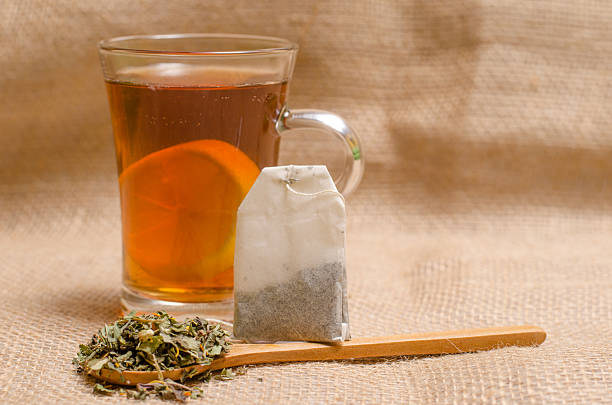 istock Cup of tea on wooden rustic background 506476038