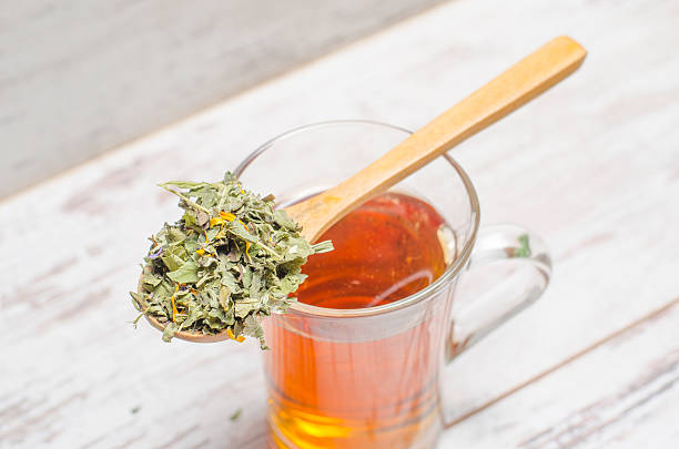 istock Cup of tea on wooden rustic background 506476160