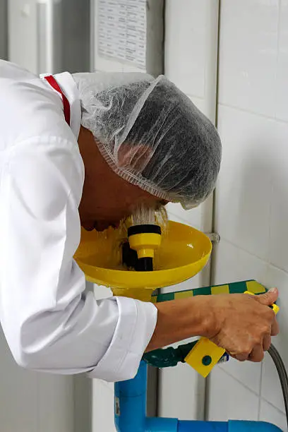 Photo of worker is using shower eyes wash