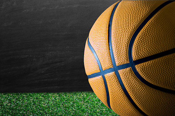 istock Yellow basketball against blackboard 506478084