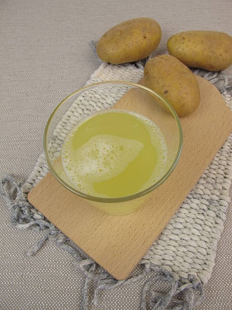 Raw potato juice stock photo