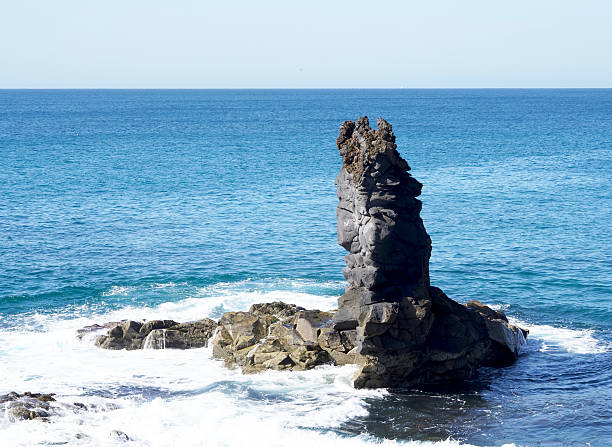 istock rock in the sea 506478564