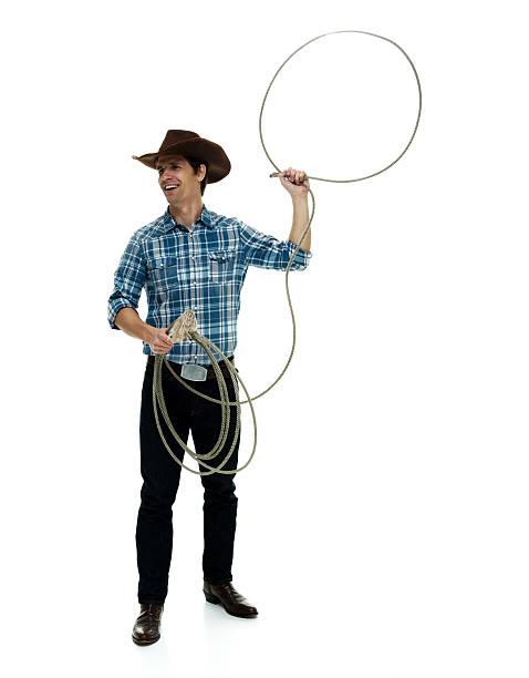 istock Smiling cowboy lassoing 506478662