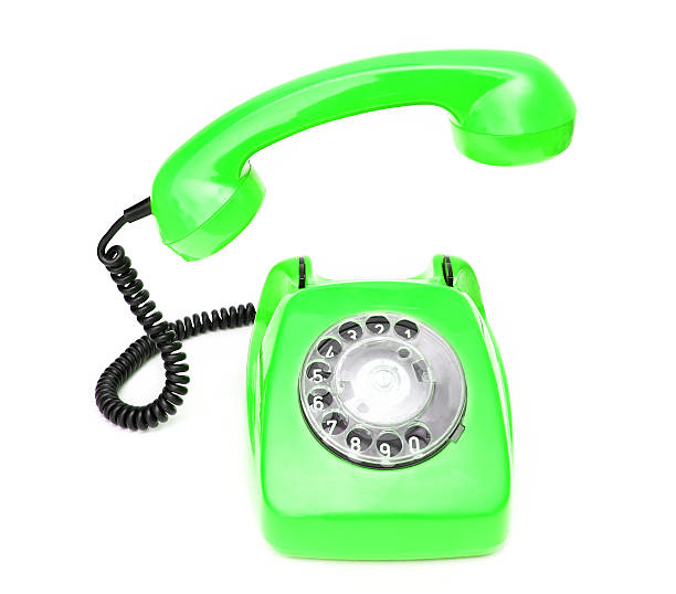 istock Green retro telephone isolated on white background. 506479600