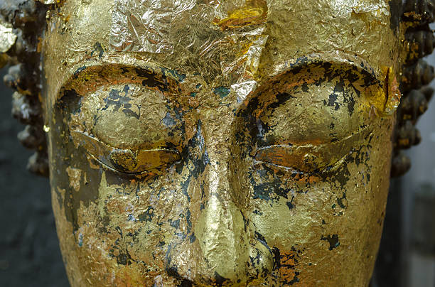 istock Buddha's face close up focus on eye. 506482586