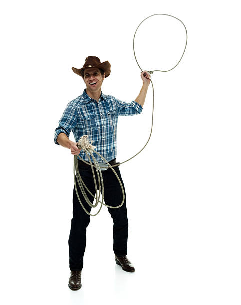 istock Smiling cowboy swinging lasso 506482932