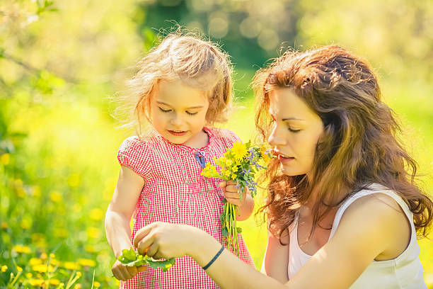 istock Mother and daughter in sunny park 506483374