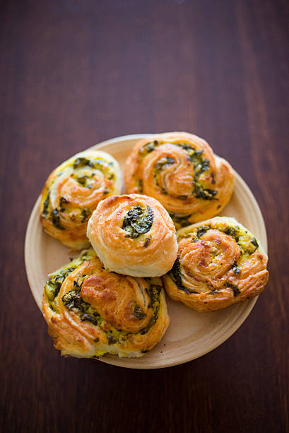 istock Baked rolls with cheese and spinach 506484860