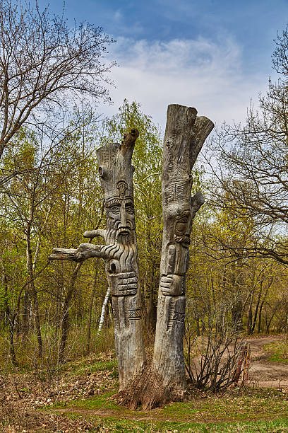 istock Two wooden idols in the wood 506485048