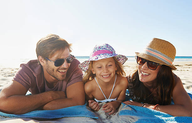 istock Bonding with mom and dad on the beach 506493275