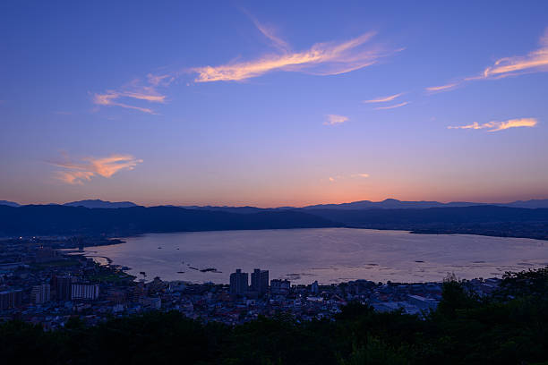 Night view of the city of Suwa Night view of the city of Suwa. The Suwa region is the leading industrial area of Nagano and was once known as "The Oriental Switzerland" for its highly developed precision machinery industry. suwa lake photos stock pictures, royalty-free photos & images