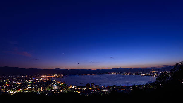 Night view of the city of Suwa Night view of the city of Suwa. The Suwa region is the leading industrial area of Nagano and was once known as "The Oriental Switzerland" for its highly developed precision machinery industry. suwa lake photos stock pictures, royalty-free photos & images