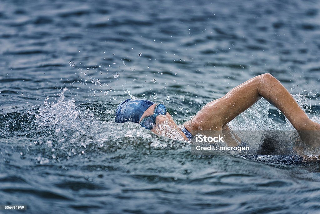 Open Water Swimming Open water swimming - female athlete swimming long distance Triathlon Stock Photo