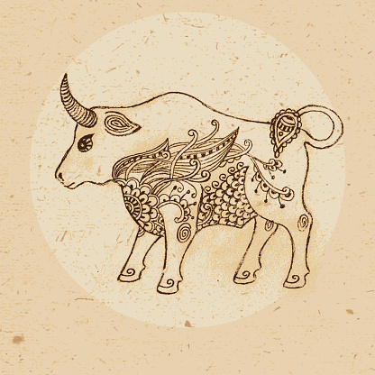 Hand drawn bull with elements of the ornament in ethnic style. Zodiac sign - Taurus. Vector illustration.