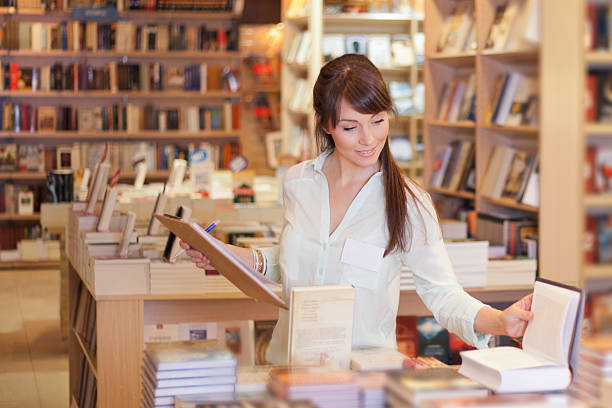 Women working at bookstore Women working at her own bookstore bookstore stock pictures, royalty-free photos & images