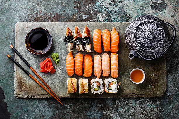 istock Sushi Set with tea on stone slate 506503112