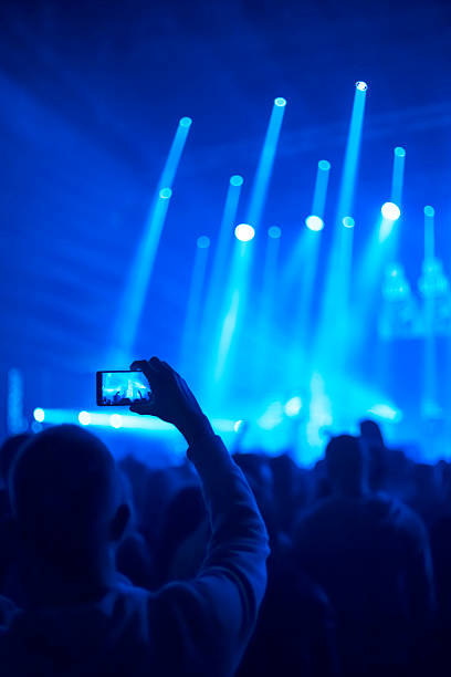 taking pictures  during a music concert