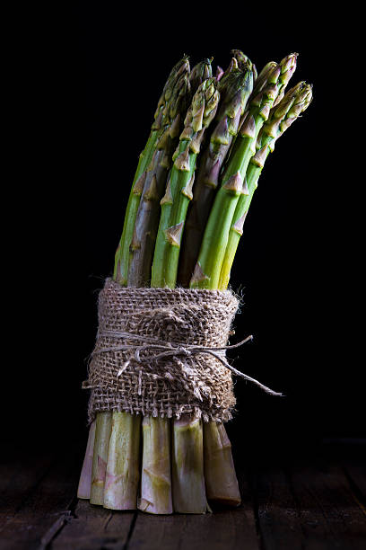 Asparagus bundle on a black background