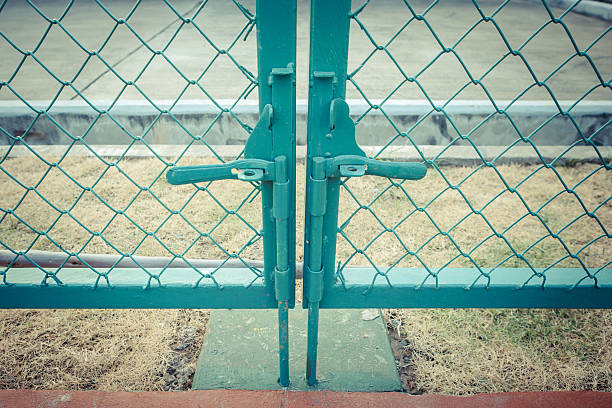 istock Green metal fence lock with pastel tone 506507300