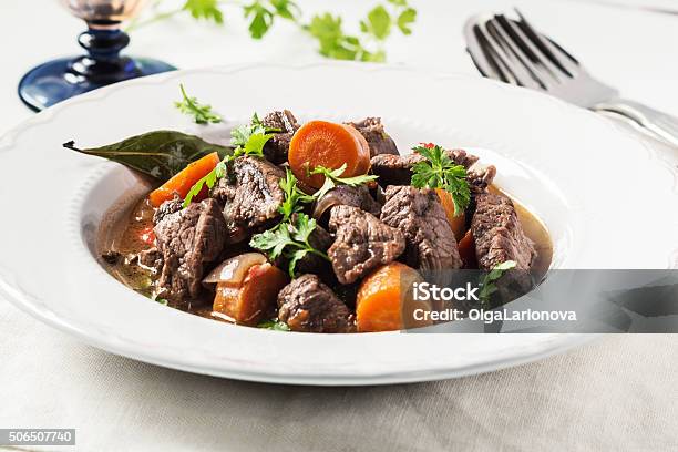 Beef Stew With Carrot On White Selective Focus Stock Photo - Download Image Now - Beef Bourguignon, Restaurant, Crock Pot