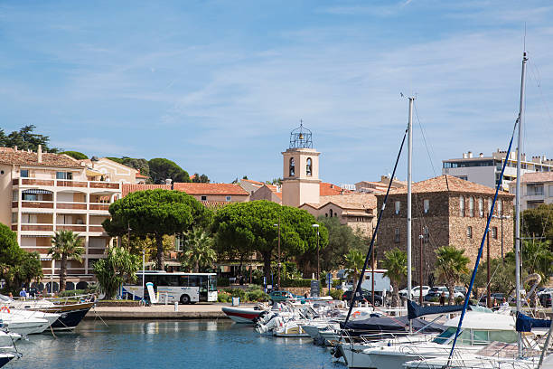 Boats at Sainte Maxime Sainte Maxime, France - September 8, 2015: The marina at Sainte Maxime in the South of France. The view is of boats in the marina with the town in the background pinus pinea photos stock pictures, royalty-free photos & images
