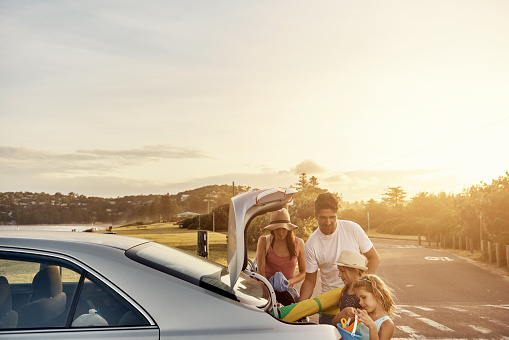 Shot of a family unpacking the car on their vacationimage806237.jpg