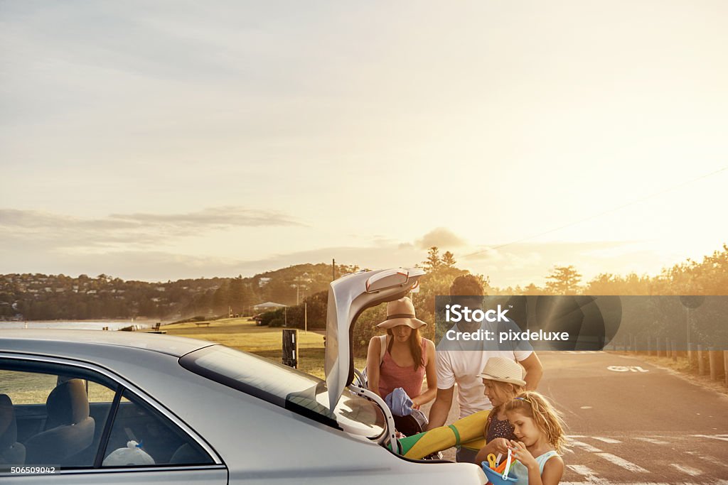 Summer adventures with family Shot of a family unpacking the car on their vacationimage806237.jpg Car Stock Photo