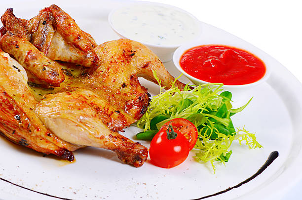 istock The baked hen with salad close-up 506512892