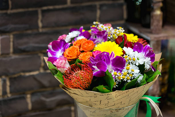 istock Flowers bouquet with Leucospermum, roses and orchids 506513402