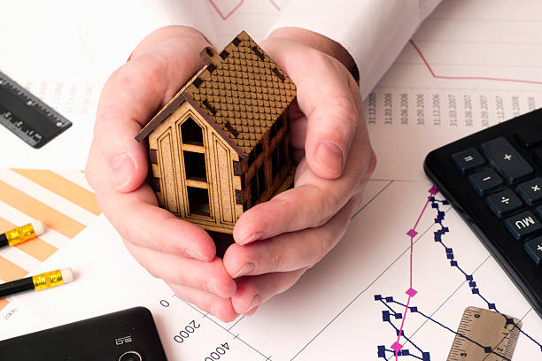 istock small house in the hands , calculator 506513832