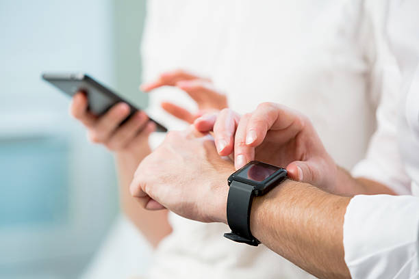 istock Close up of man hands with smart watch 506516242