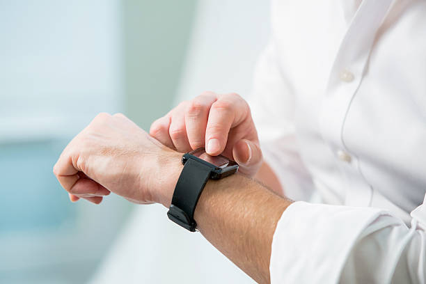 istock Close up of man hands with smart watch 506516404