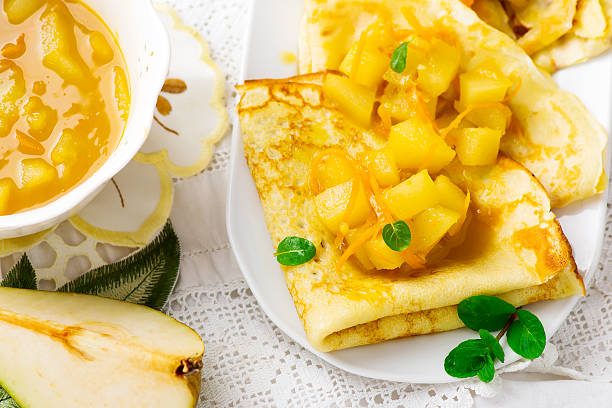 istock pancakes with orange and pears sauce 506517034