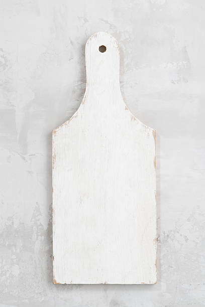 istock concept photo, white wooden cutting board, top view 506517844